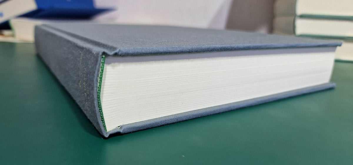 Canons and Decrees of the Council of Trent, blue cloth-bound volume with sewn book block